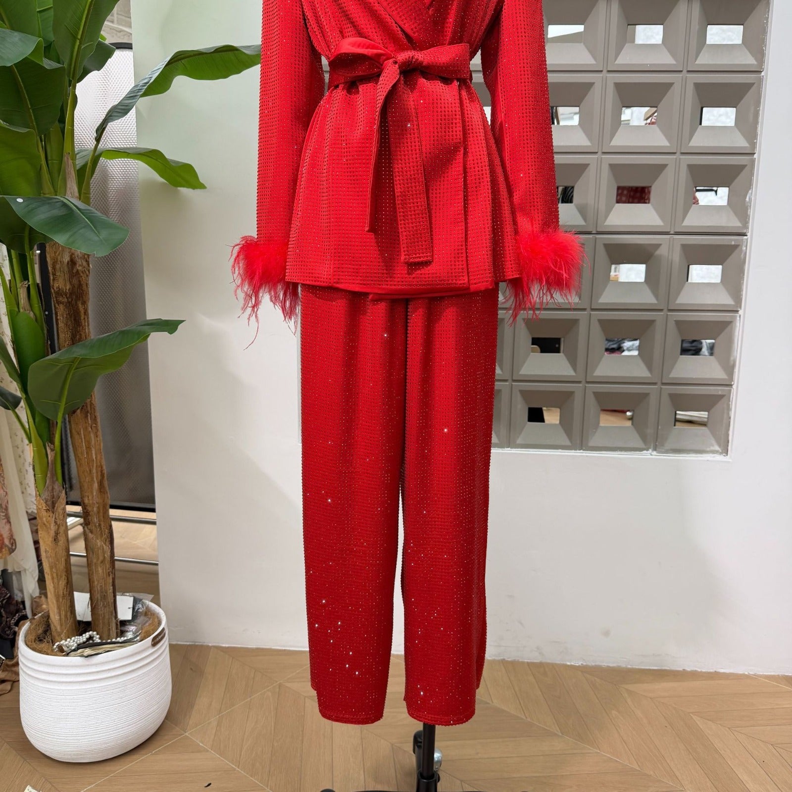 Red Bedazzled trousers with matching red Bedazzled  jacket.