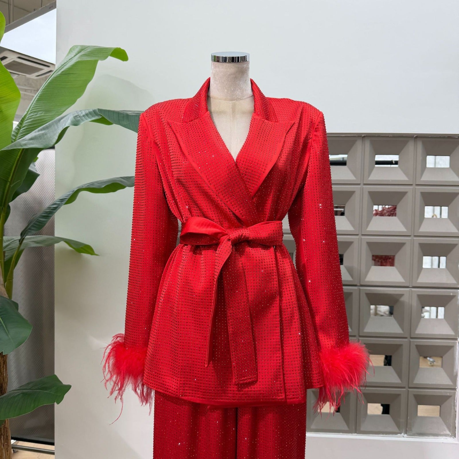Red Bedazzled trousers with matching red Bedazzled  jacket.