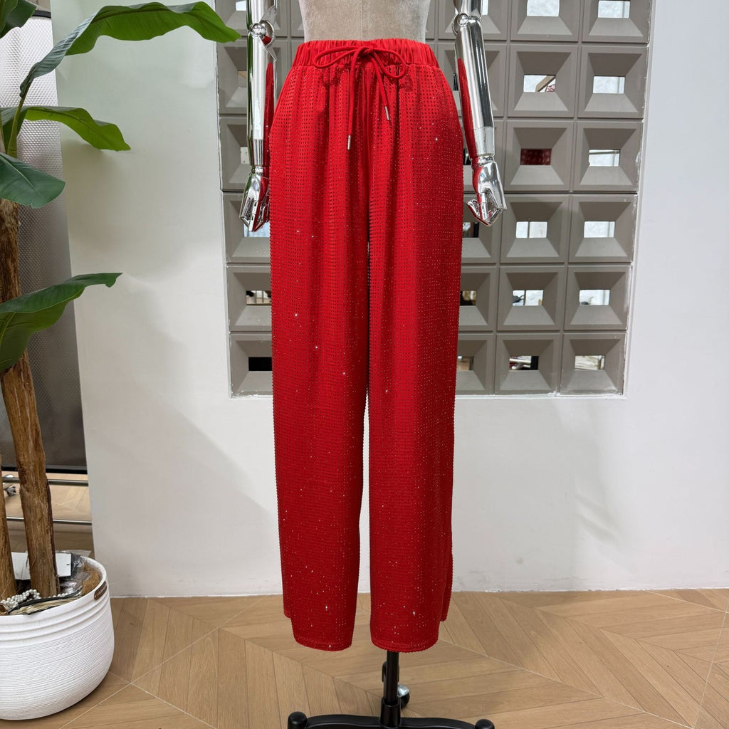 Red Bedazzled trousers with matching red Bedazzled  jacket.