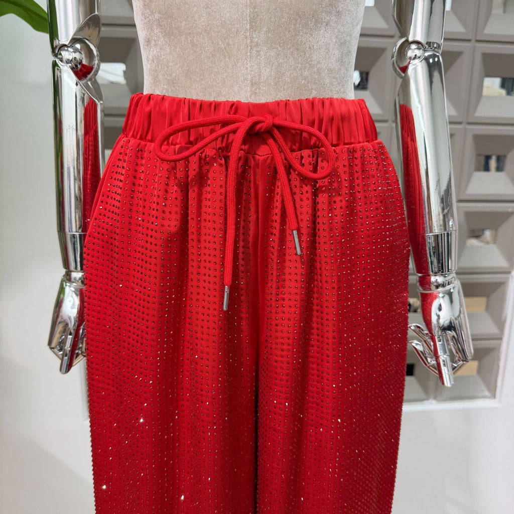 Red Bedazzled trousers with matching red Bedazzled  jacket.